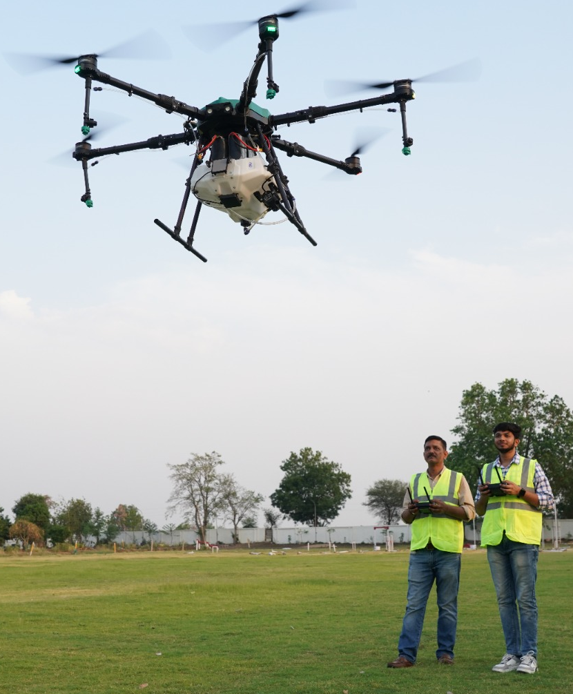 professional drone pilot with headset and tech glasses focused on a tablet screen outdoors in a bright airfield environment
